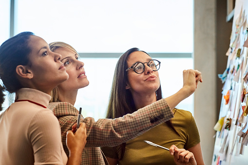 Women Looking At board 1